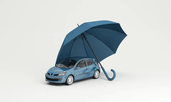Modern visual of a car driving safely under an insurance umbrella